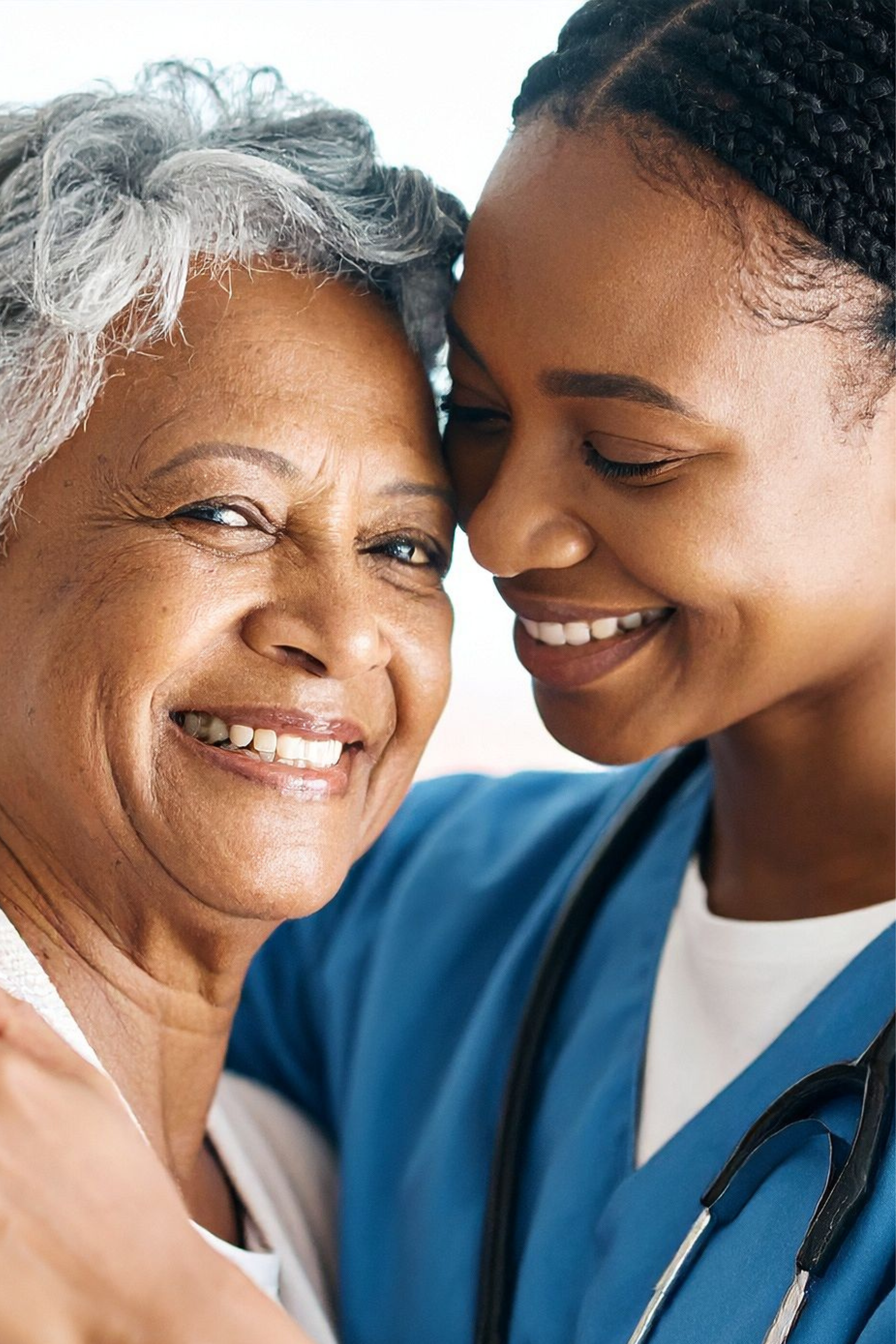 Caregiver holding hands with an elderly patient.